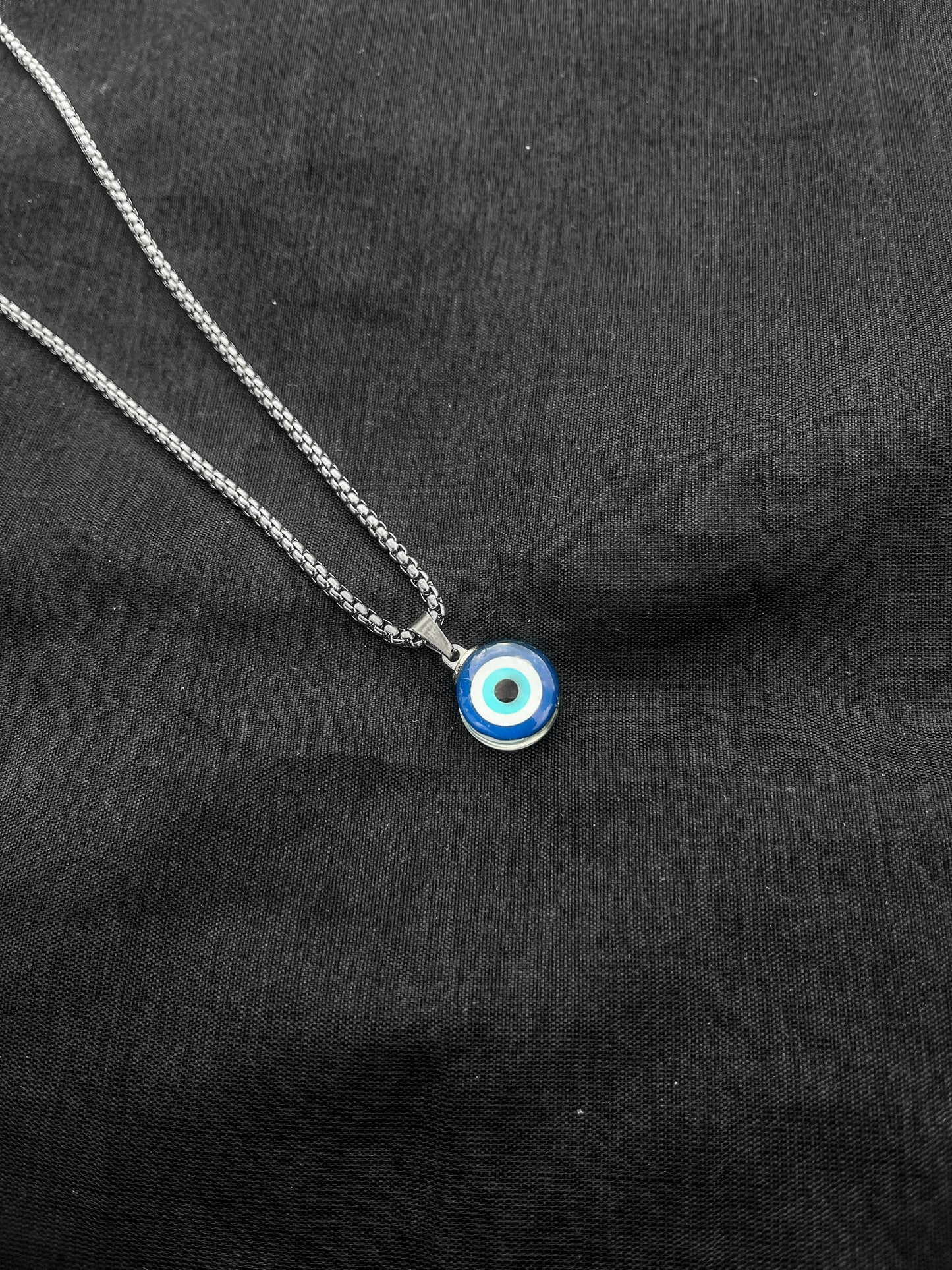 Black dotted bracelet and evil eye chain